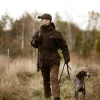 Deerhunter Pro Gamekeeper Jacket in green worn outdoors with a dog