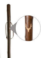 Stag engraving on chestnut hiking stave a strong visual for countryside walkers and gift buyers