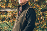 Man out on the field wearing the Jack Pyke Countryman fleece gilet with pheasant over a knitted jumper for added warmth