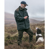 Man on mountain wearing the Hoggs of Fife Sportsman Pro waterproof fleece jacket whilst dog training Man on mountain wearing the Hoggs of Fife Sportsman Pro waterproof fleece jacket whilst dog training