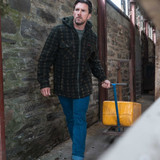 Farmer pulling a trolly whilst wearing the Hoggs of Fife Caithness hooded fleece shacket
