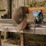 Deerhunter Eagle Cap in brown displayed on a workshop bench