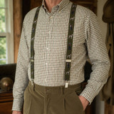 Farmer wearing labrador designed braces with a check shirt