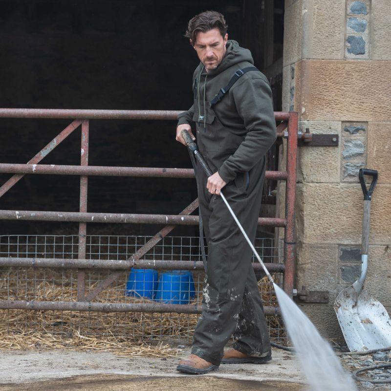 Farmer wearing Hoggs of Fife Green King II Waterproof Bib and Brace