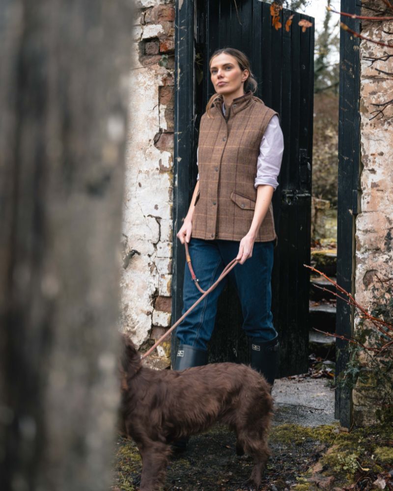 Farmer wearing Hoggs of Fife Eden Tweed Gilet whilst walking the dog