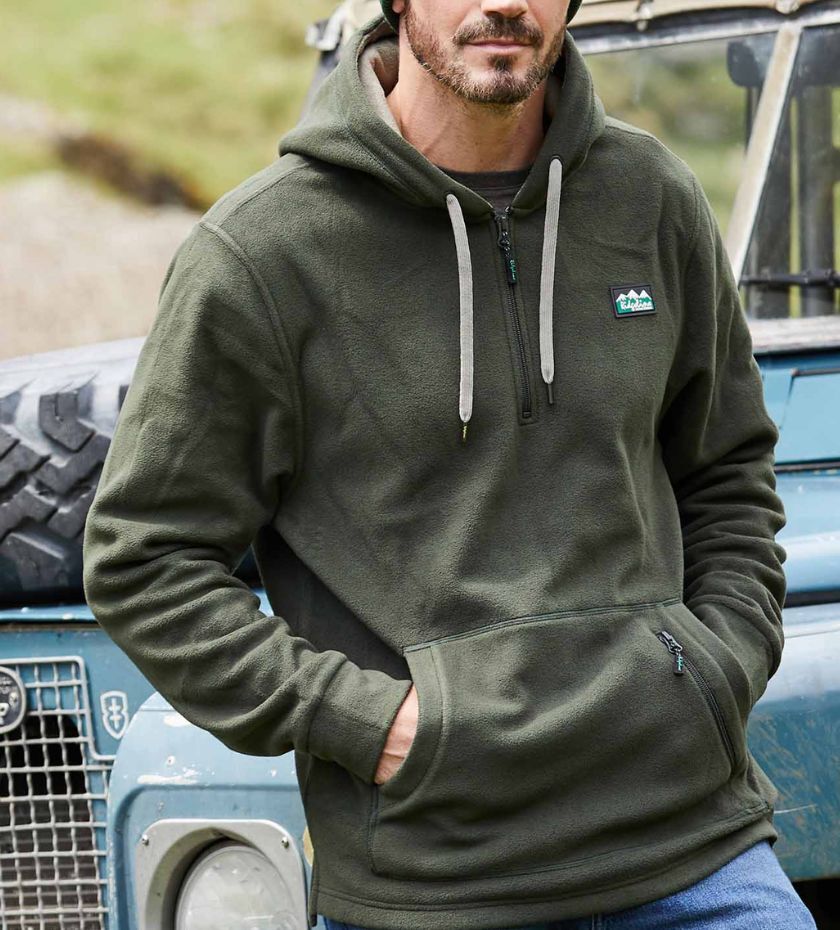 Farming hoodie. Farmer wearing hoodie next to land rover