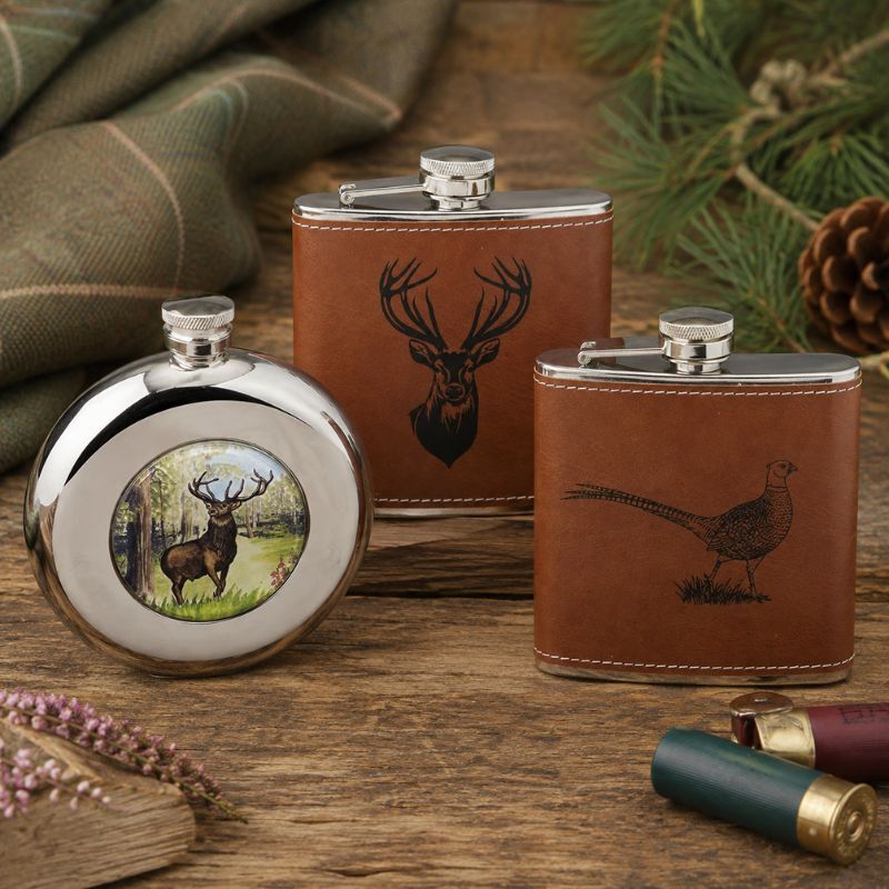 Country shooting hip flasks with stag and pheasant designs arranged as gifts