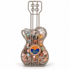 Guitar-shaped Arizona gift basket featuring a silver-tone decorative wire frame filled with colorful chocolate rocks. The design includes a round Arizona medallion with a Southwestern sunset and cactus motif.