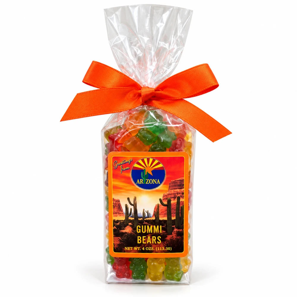Clear gift bag filled with colorful Arizona Gummi Bears, decorated with a bright orange bow and an Arizona-themed label featuring a desert sunset, red rock formations, and saguaro cacti. Net weight 4 oz (113.30 g).