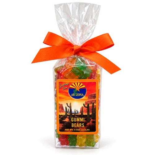 Clear gift bag filled with colorful Arizona Gummi Bears, decorated with a bright orange bow and an Arizona-themed label featuring a desert sunset, red rock formations, and saguaro cacti. Net weight 4 oz (113.30 g).