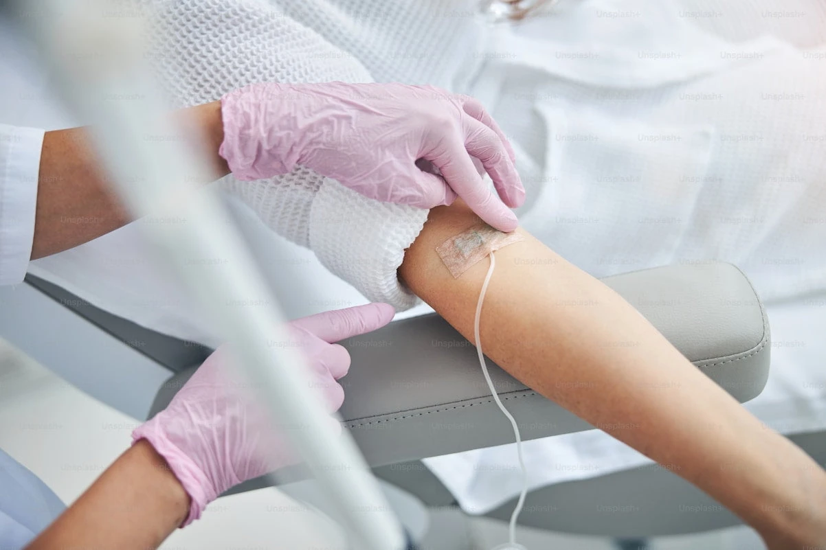 Clinician dressing a patient wound