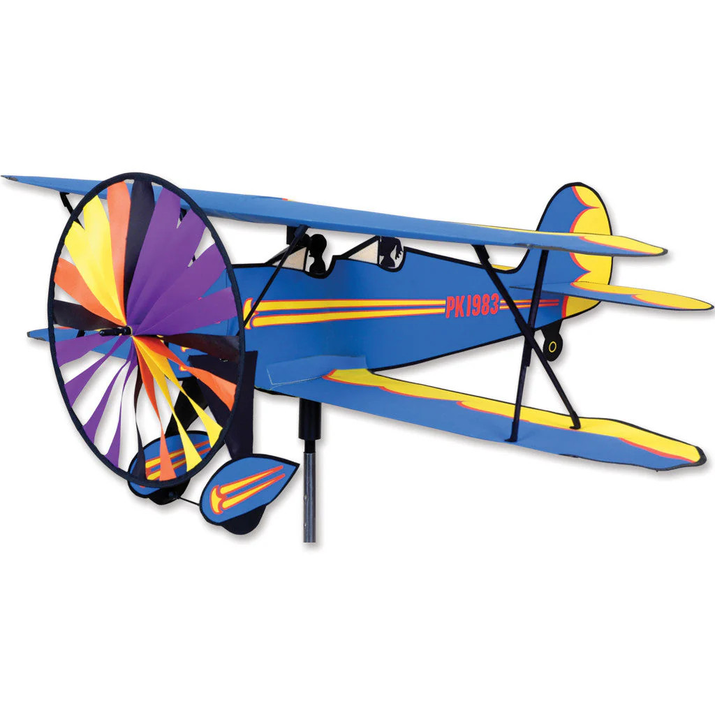 Biplane airplane wind spinner rotating in a garden yard