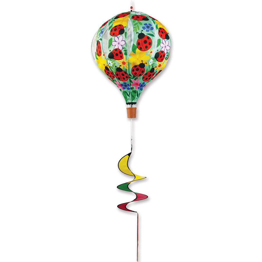 Lady Bug hot air balloon wind spinner spinning outdoors in a garden, colorful whimsical yard decoration