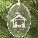 Nativity scene personalized glass ornament has beveled edges, hanging ribbon, and comes in a black velvet pouch.
