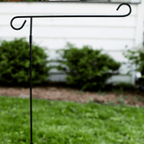 Black metal garden flag pole.