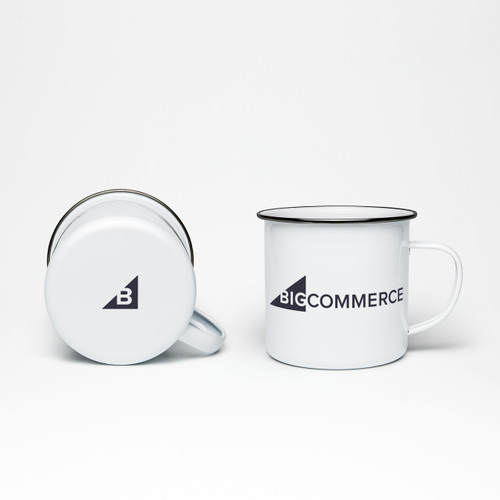 Two BigCommerce enamel mugs. One laying on its side showing the bottom logo mark and the other upright showing and front logo.