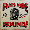 Flat Tires Made Round Metal Sign by Marty Mummert