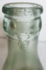 Original straight sided embossed Coca-Cola bottle with paper label circa 1900's