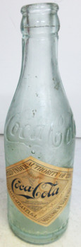 Original straight sided embossed Coca-Cola bottle with paper label circa 1900's