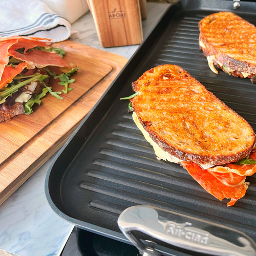 https://cdn11.bigcommerce.com/s-tpv42kg/images/stencil/500x659/products/461/21618/2100118428_-_All-Clad_-_Double_Burner_Grill_-_Grilled_Cheese_Recipe_-_02__14329.1698154928.jpg?c=2