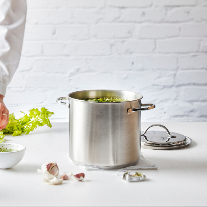 Large stainless-steel stock pots by All Clad and Demeyere
