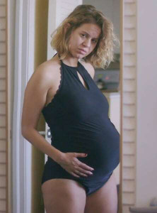 Emily Althaus wearing silicone fake pregnant belly in Claire at Seven Months