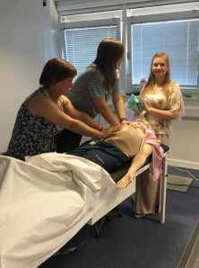 Manual displacement medical checks on artificial pregnant belly
