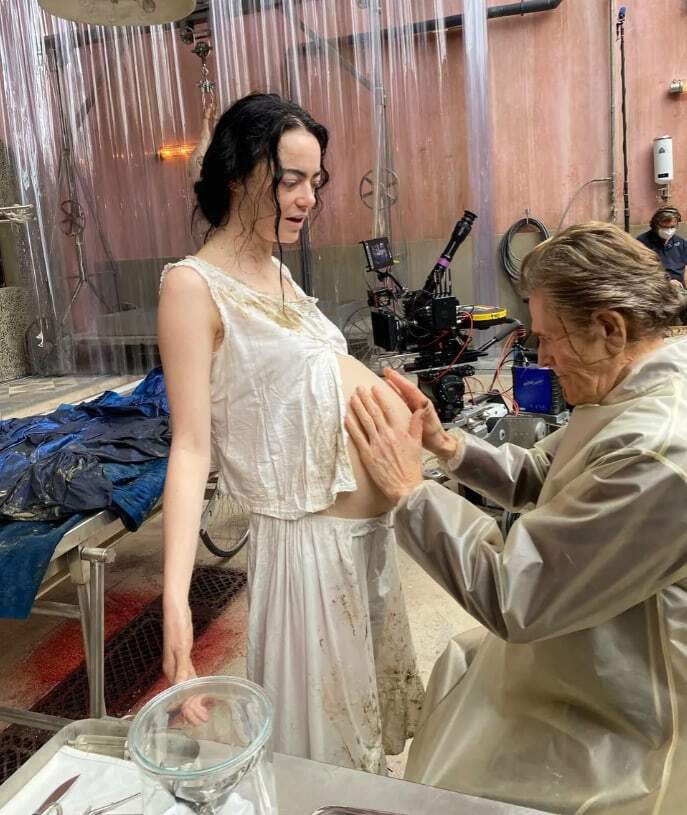 Emma Stone's character Victoria in Poor Things featuring a realistic pregnant belly