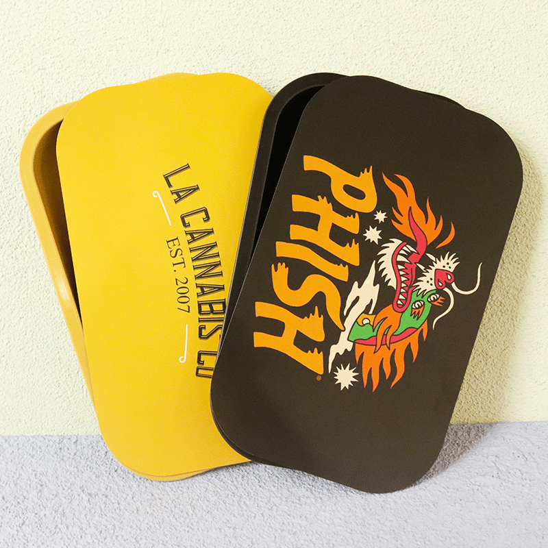 A custom metal rolling tray with a lid to carry it