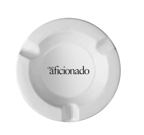 A ceramic ashtray with a custom logo and cigarettes