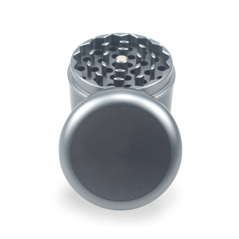 A custom logo on the smooth, polished top of the compact grinder.