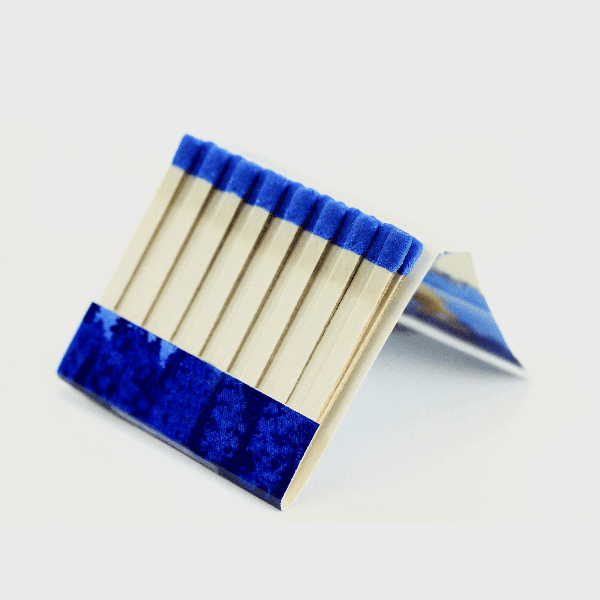 A collection of custom branded matchbooks with various designs.