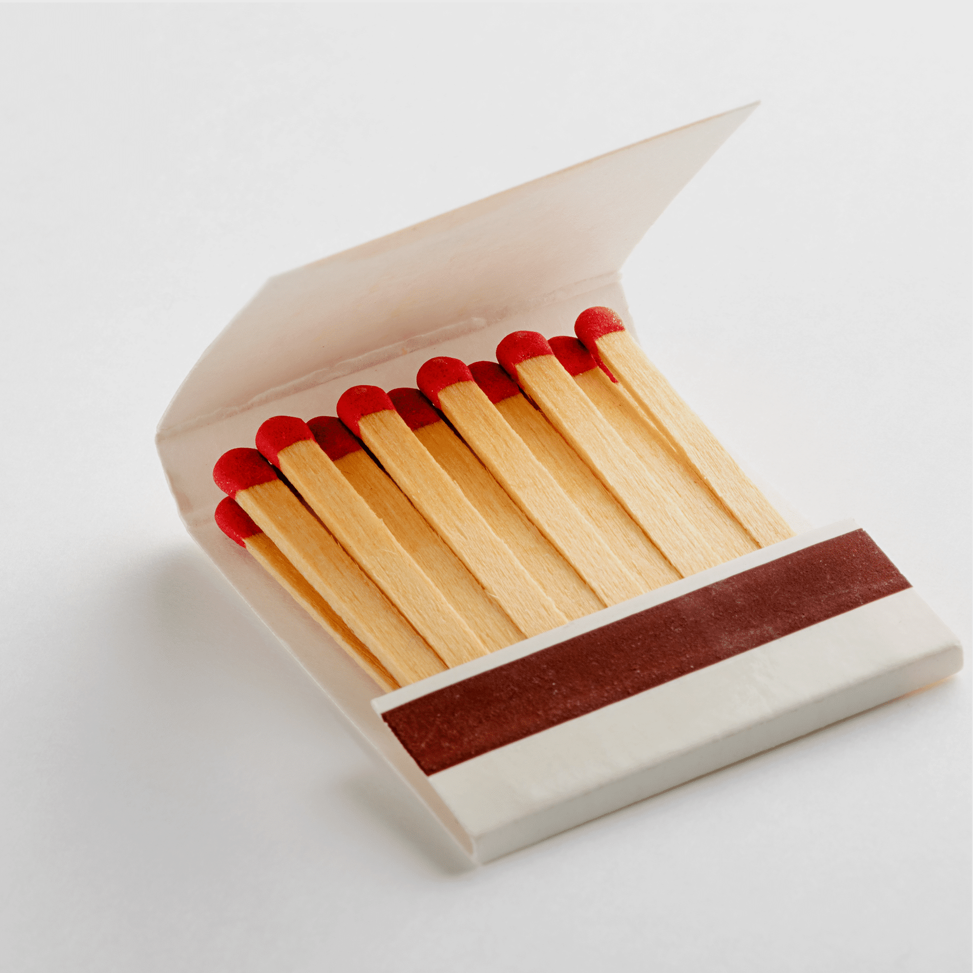 Custom matchbooks showing base paper options and branding.