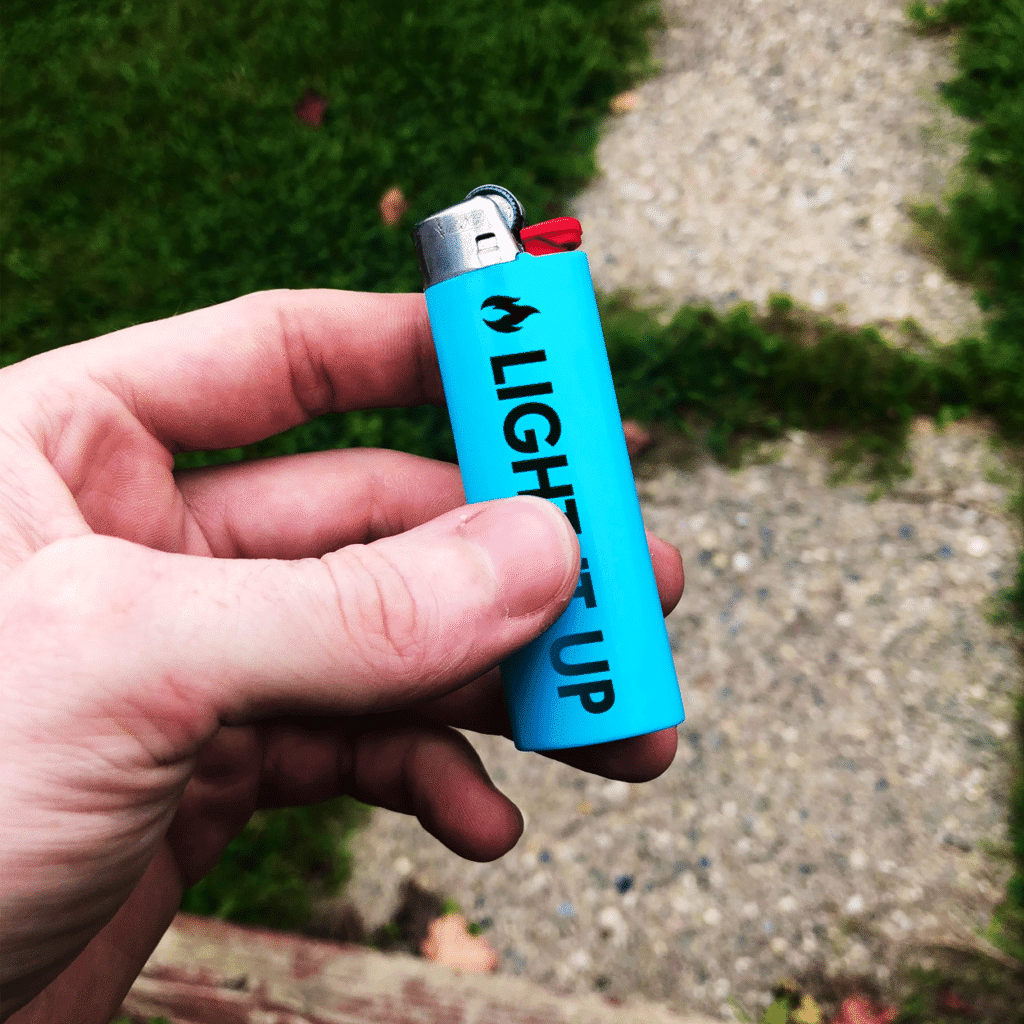 Official BIC Lighters in assorted light colors with custom black print.