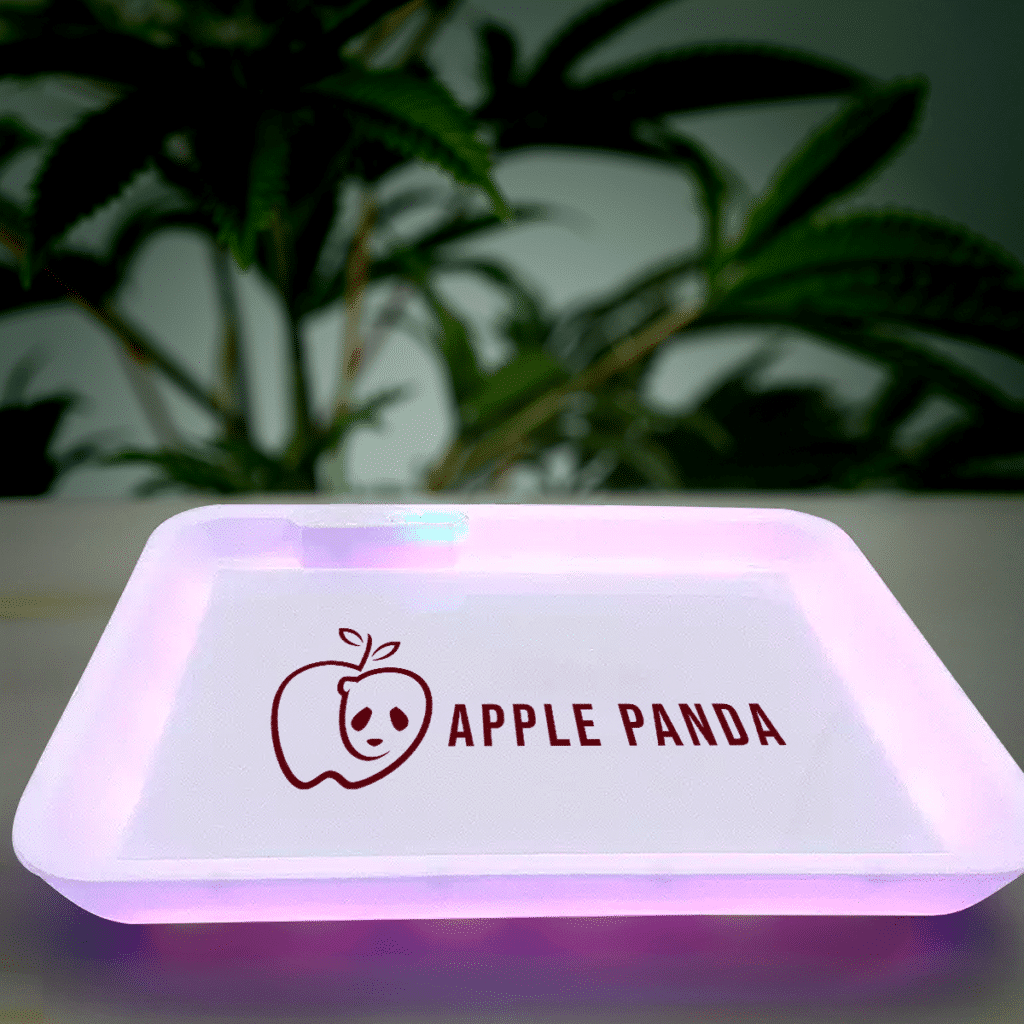 A custom LED rolling tray illuminating a smoke session.