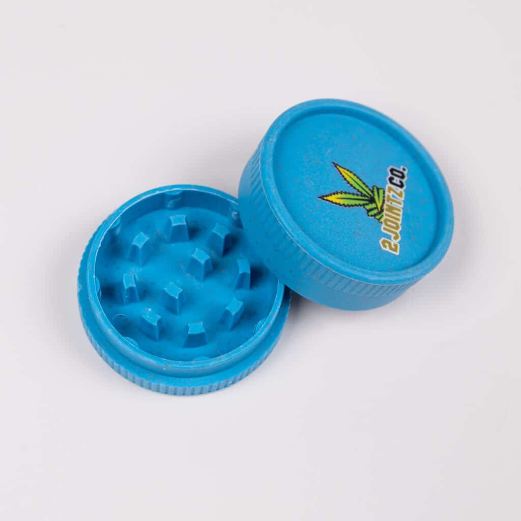 The portable and biodegradable hemp grinder being held in hand.