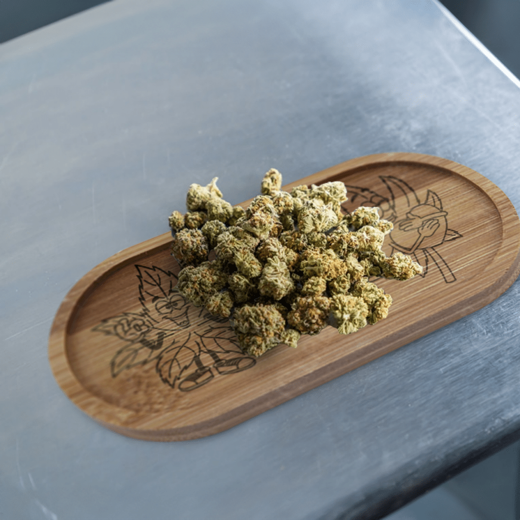 A person using the mini bamboo oval rolling tray, showcasing its superior design.