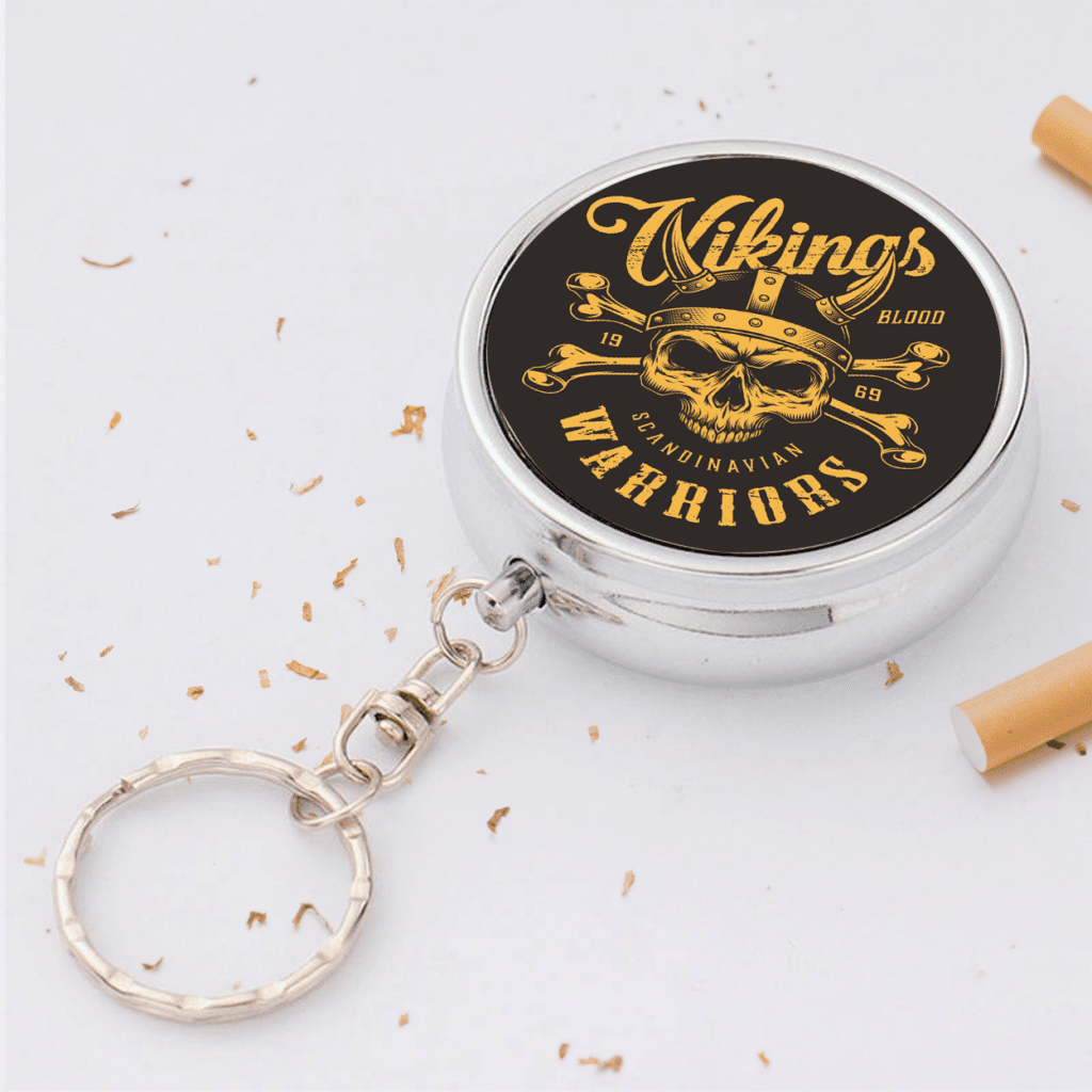 A custom portable metal ashtray keychain.