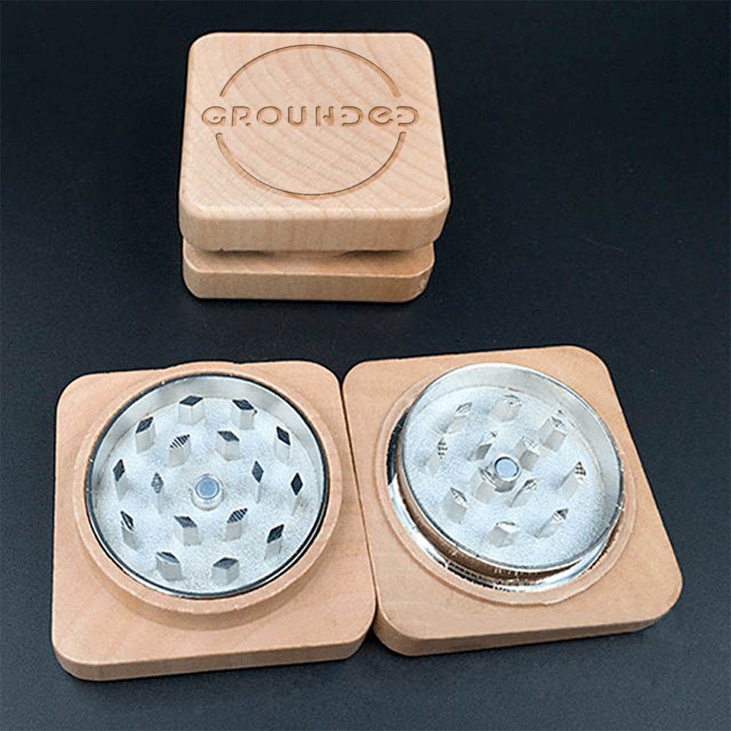 A sleek and stylish square wooden grinder.