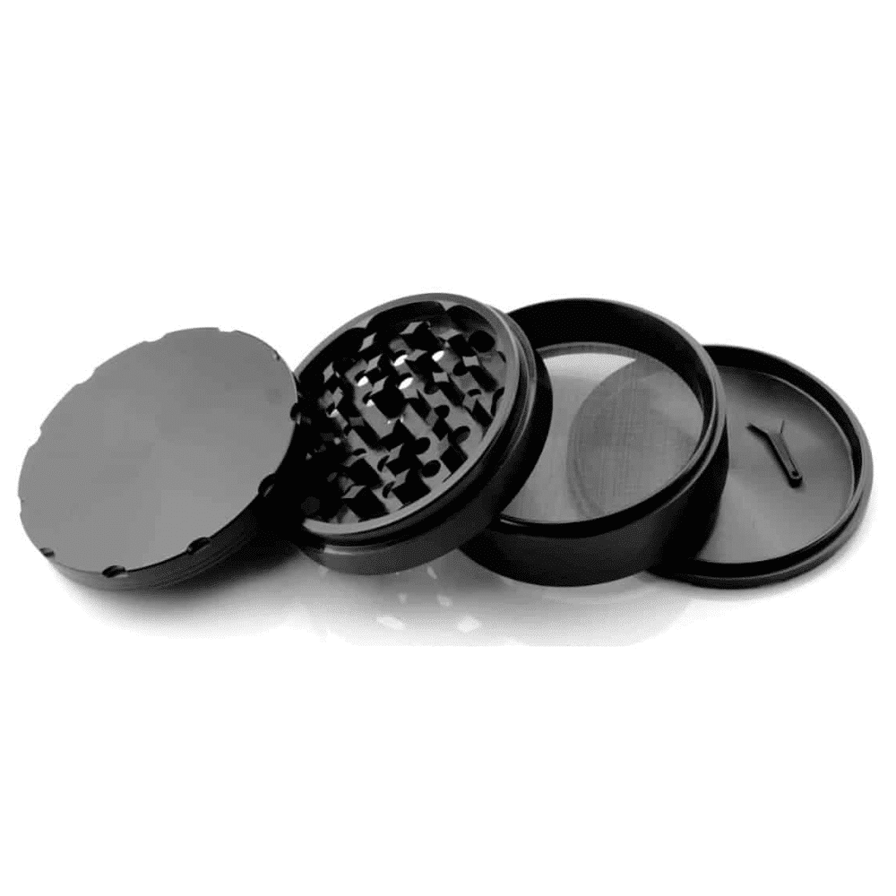 Top view of the black herb grinder with its included tool.