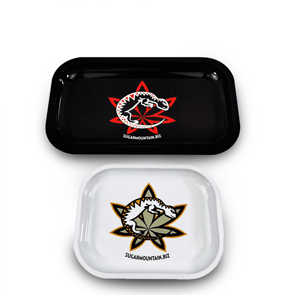 Custom tin rolling trays with stylish black and white graphic designs.