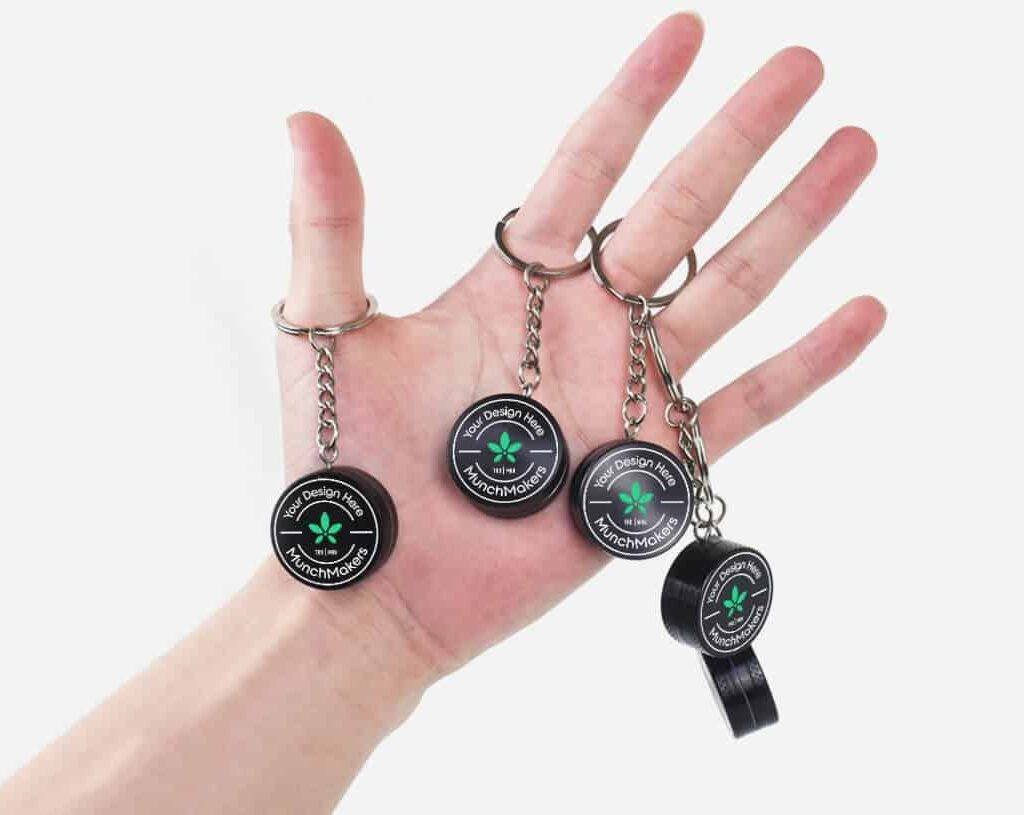 A small but powerful mini grinder keychain with a custom logo.
