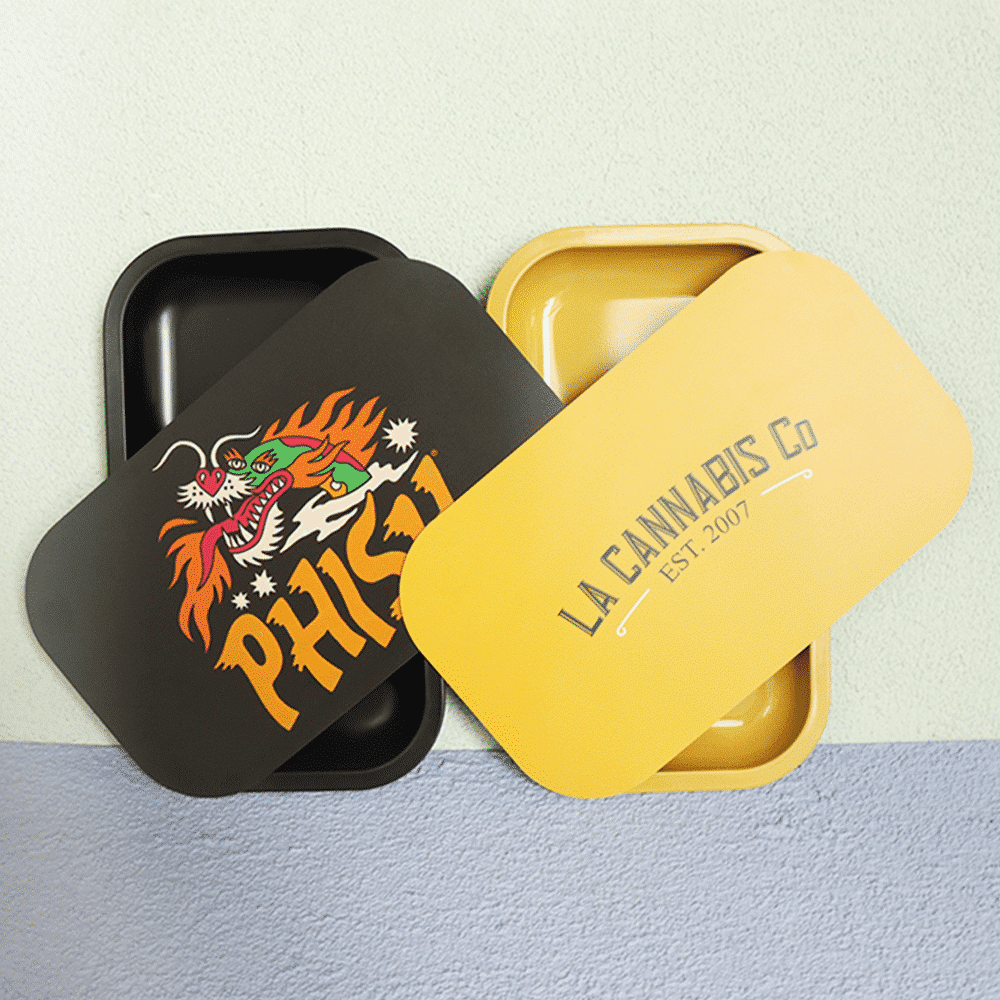 Custom rolling trays with a magnetic lid, featuring a minimalist dragon design.