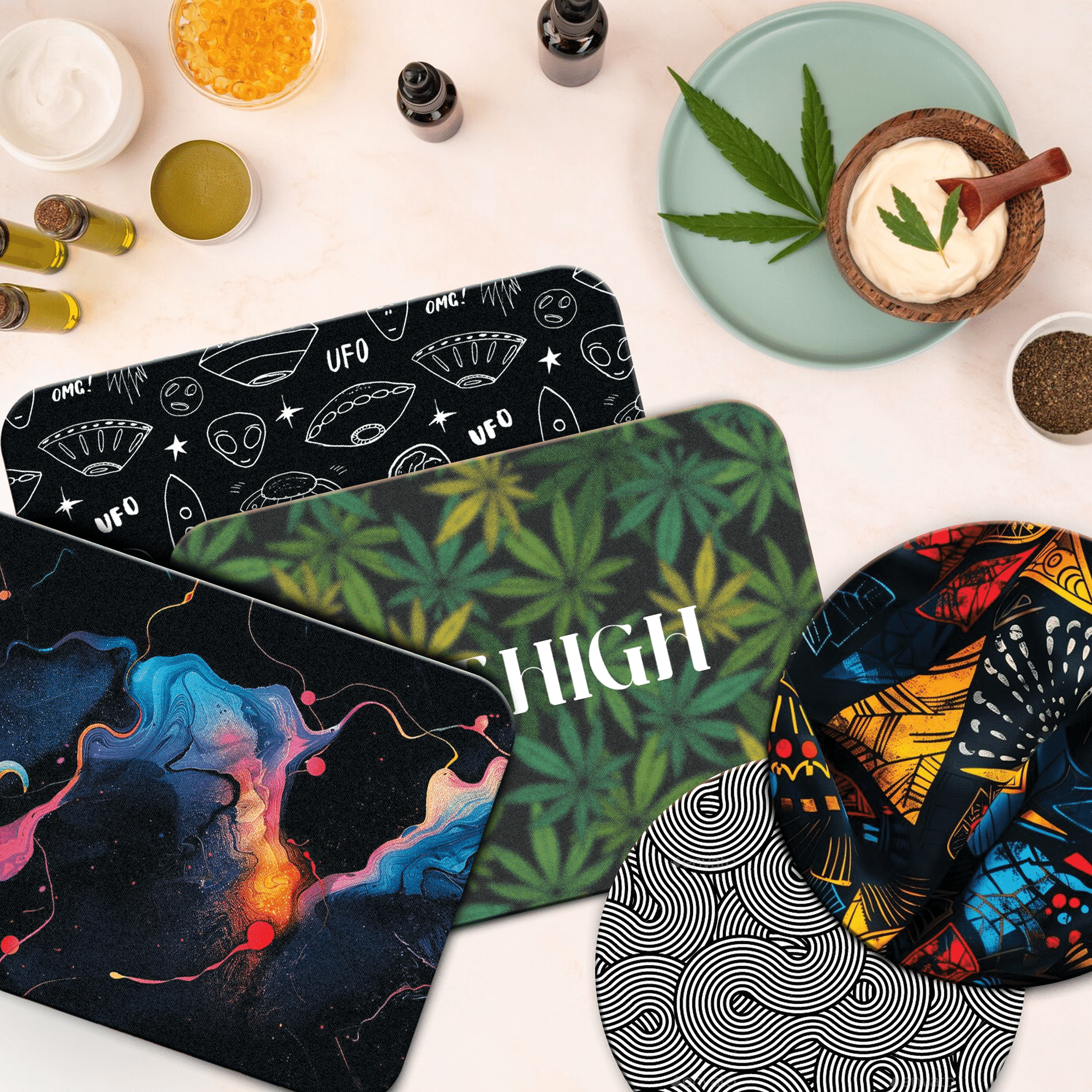 A collection of custom dab mats with various vibrant designs.