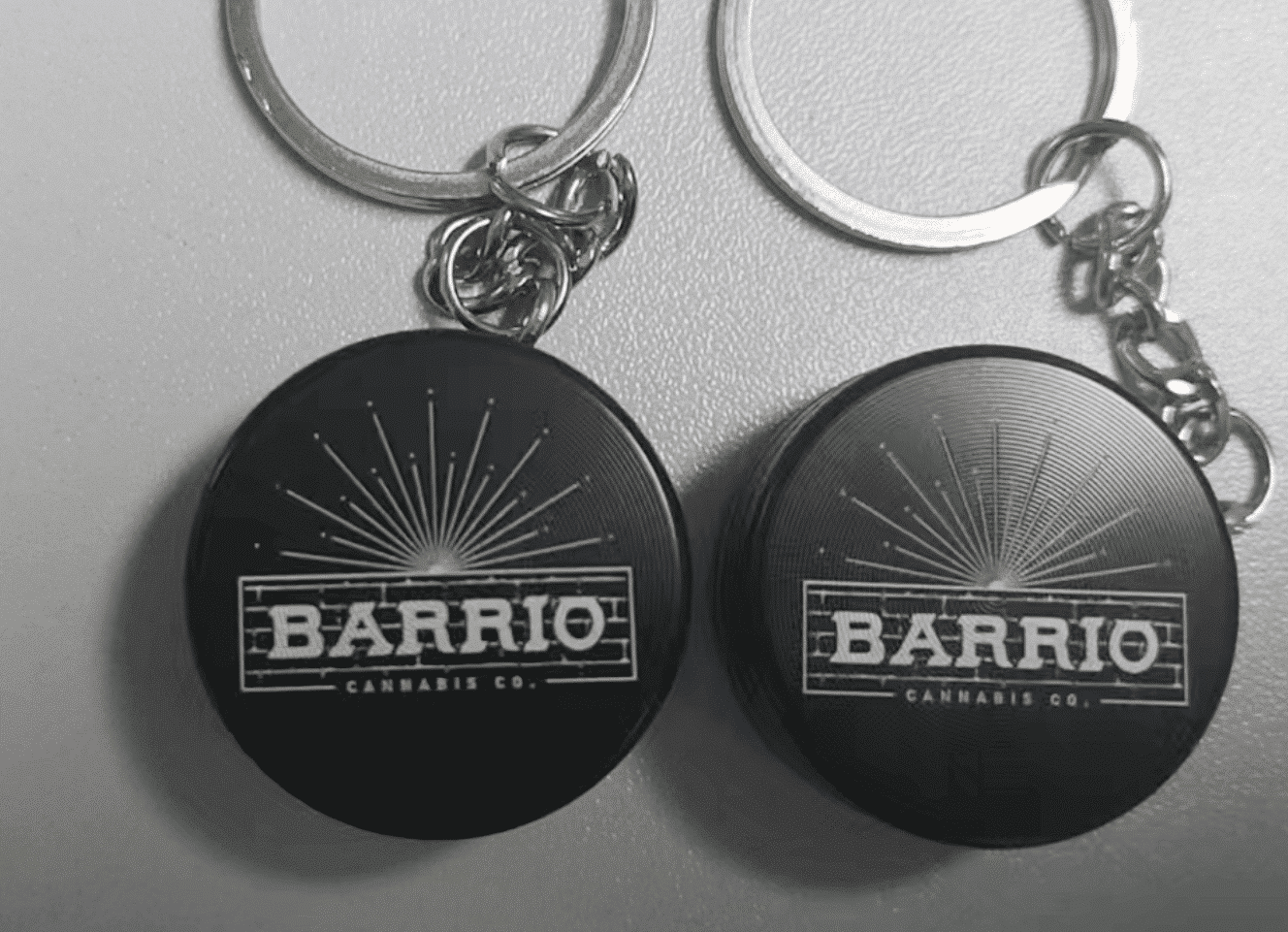 A durable keychain grinder attached to a set of keys.