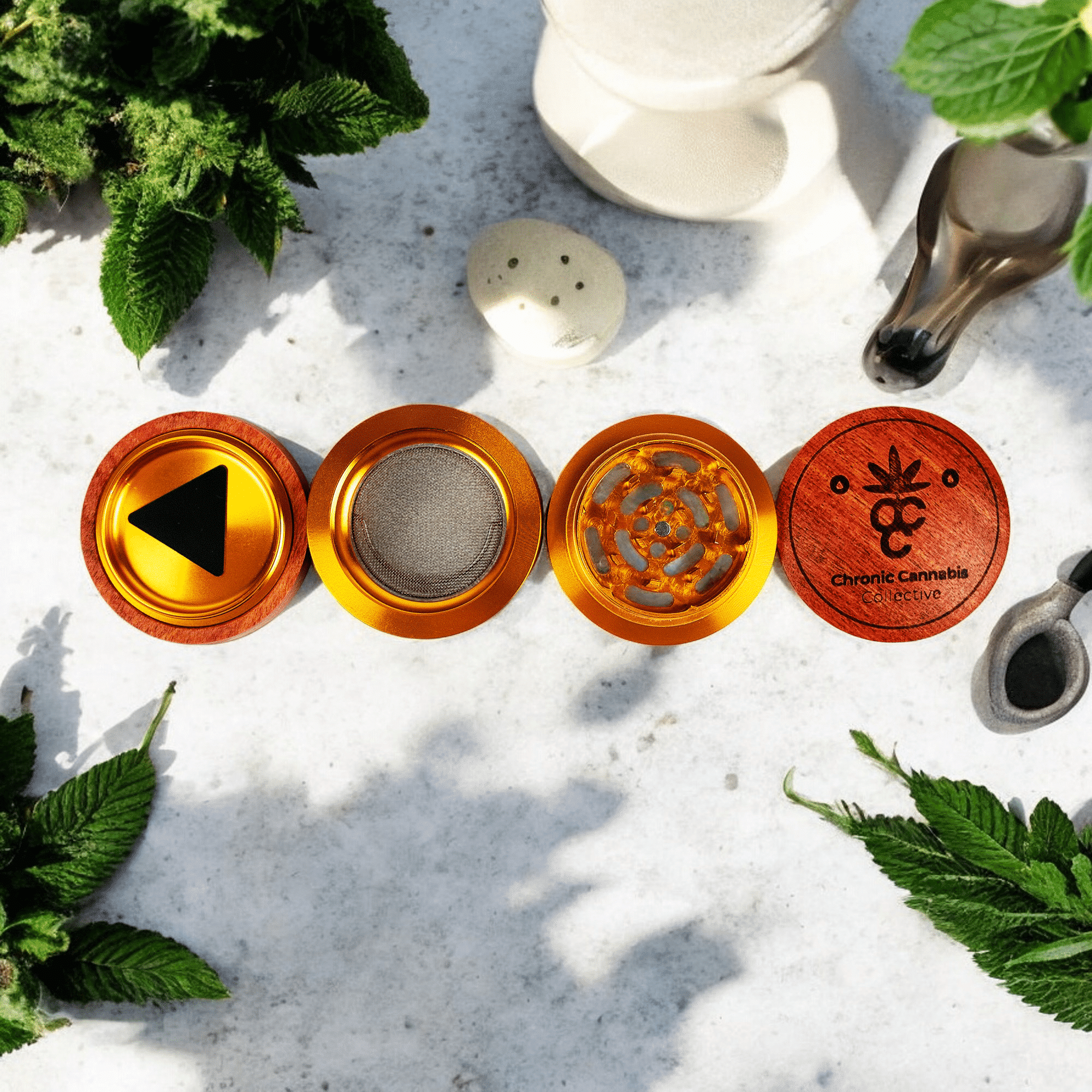 The four pieces of the wood and aluminum grinder displayed.