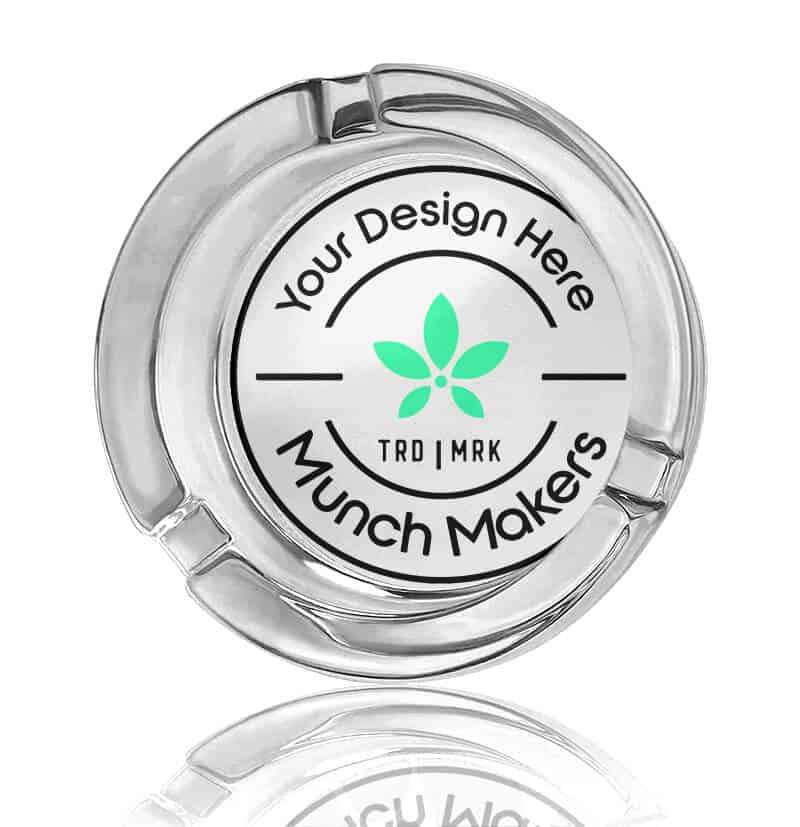 A custom glow in the dark ashtray with a permanent print logo encased in glass.
