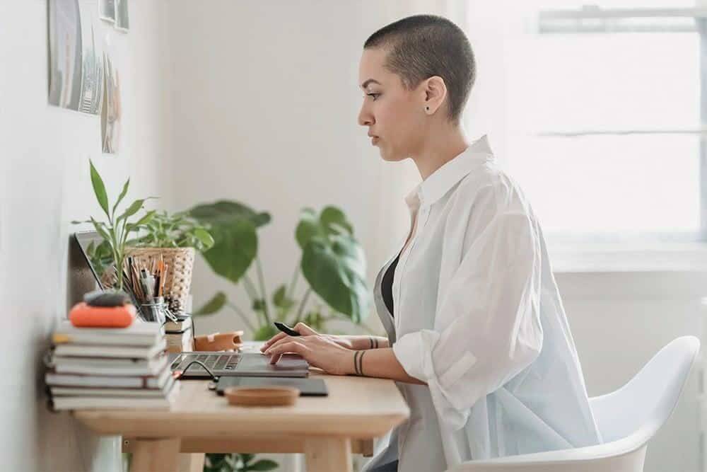 Woman typing at computer