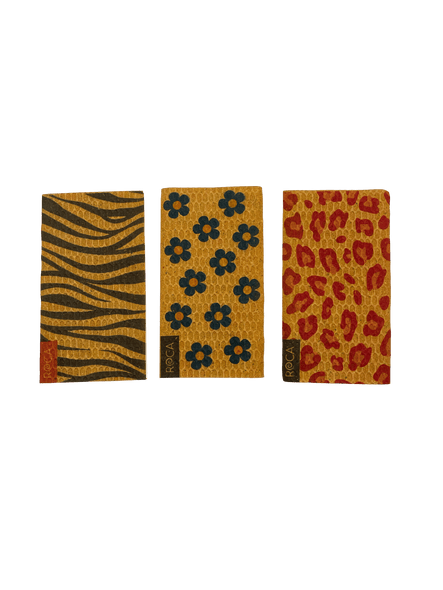 An exploded-view diagram illustrating the layers of a product. From top to bottom, the layers shown are a transparent film, a holographic sheet, a copper foil, a pre-cut patterned layer, and the final assembled textured product at the bottom.