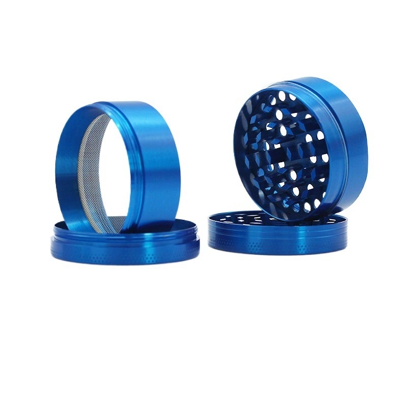 Close up view of the 4-piece grinder components including the mesh screen